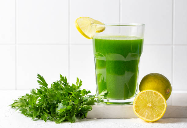 Green healthy detox, lemon and parsley juice. Green vegetable smoothie